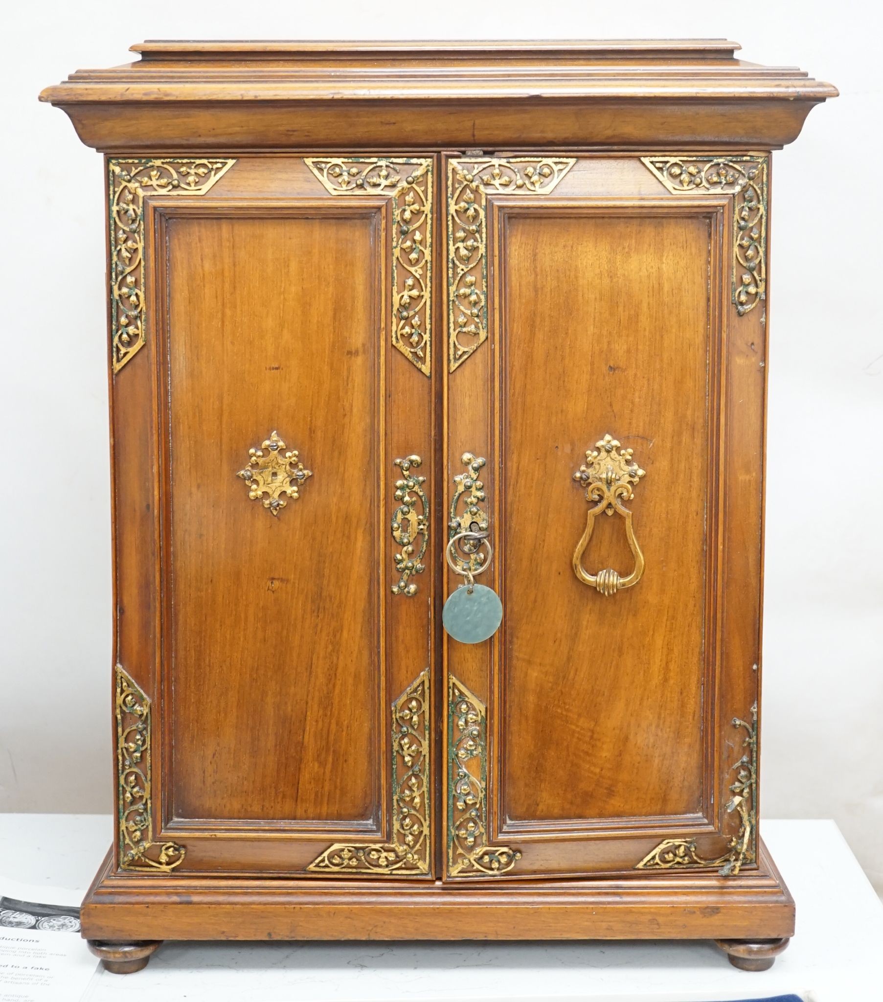 A late 19th century gilt metal mounted walnut games cabinet, W.40cm D.19cm H.49cm